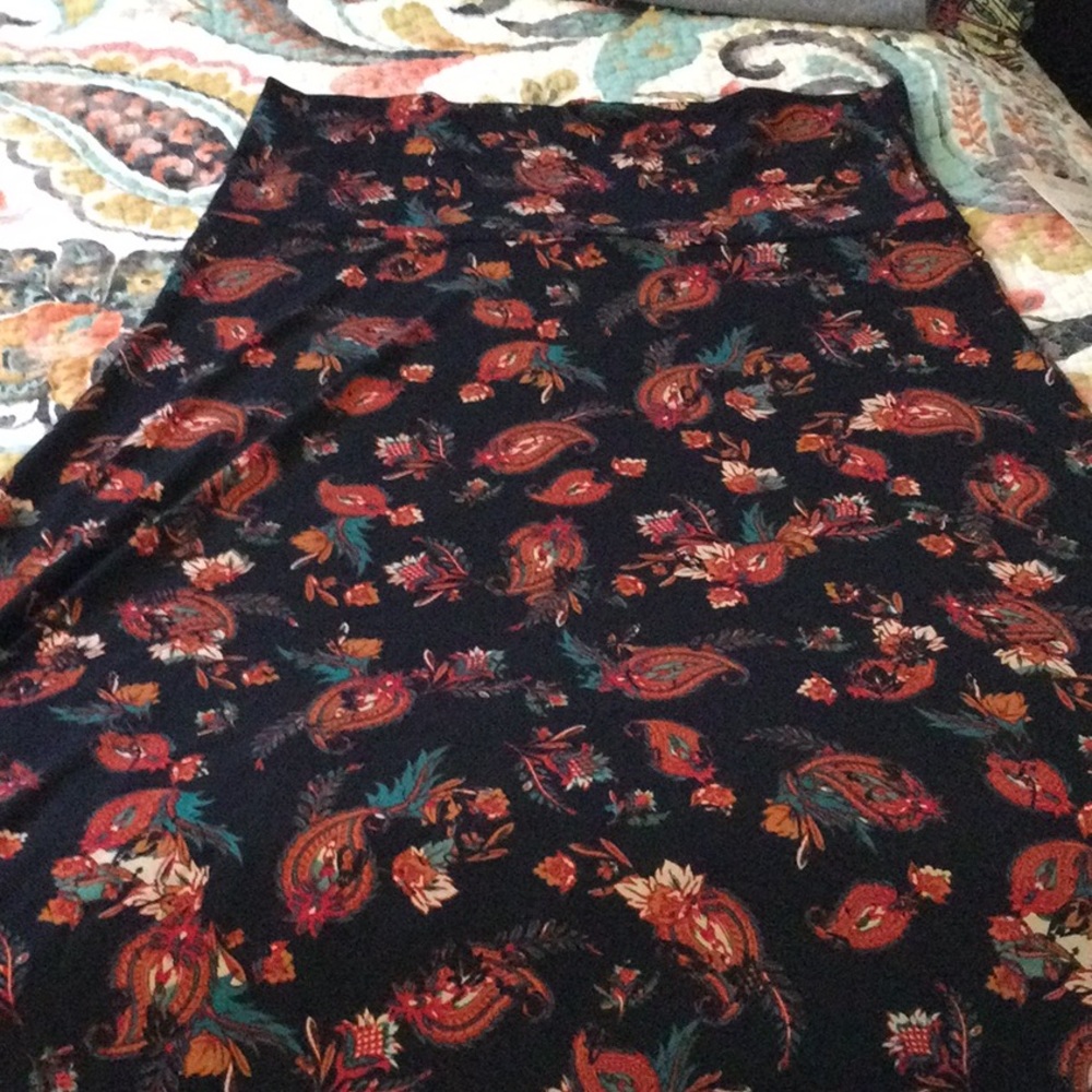 New with tags Lularoe Maxi Skirt, size Medium. Black w/ a paisley pattern